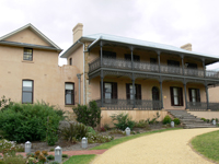 Close up of two story building with veranda and balcony