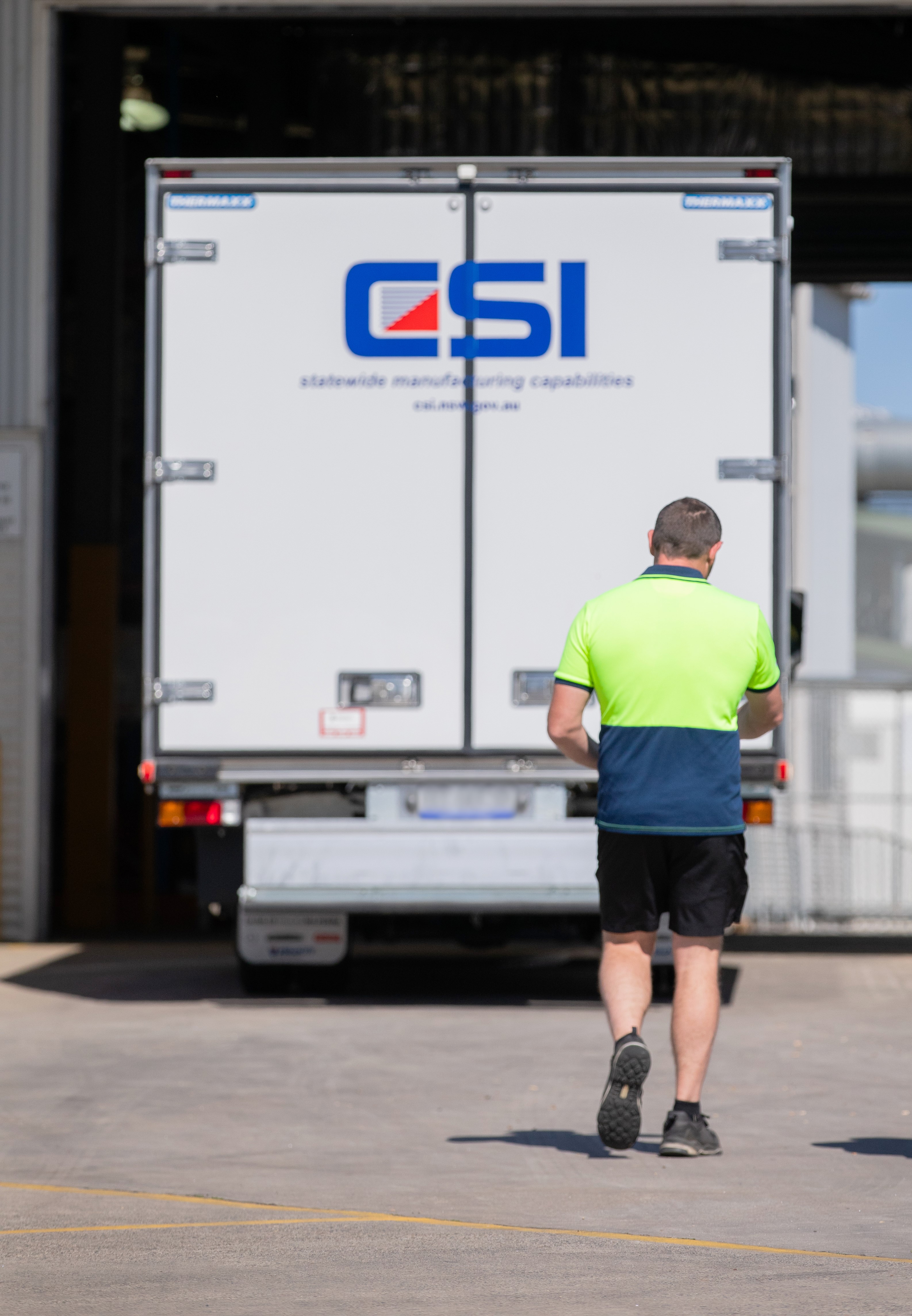 Man walking towards large truck