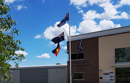 MaryWadeCC_entranceflags Flags flying outside the entrance to the new Mary Wade Correctional Centre.